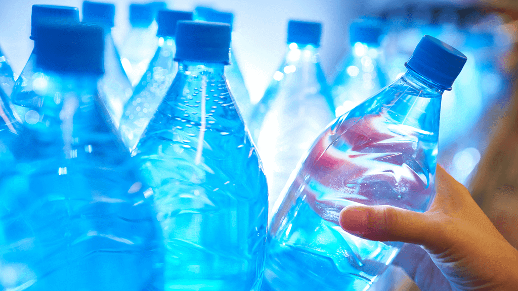 Water taking bottled water from store shelve to purchase