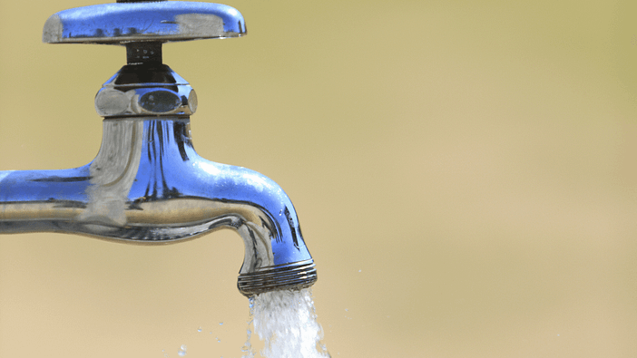 Tap water faucet running water with open spigot